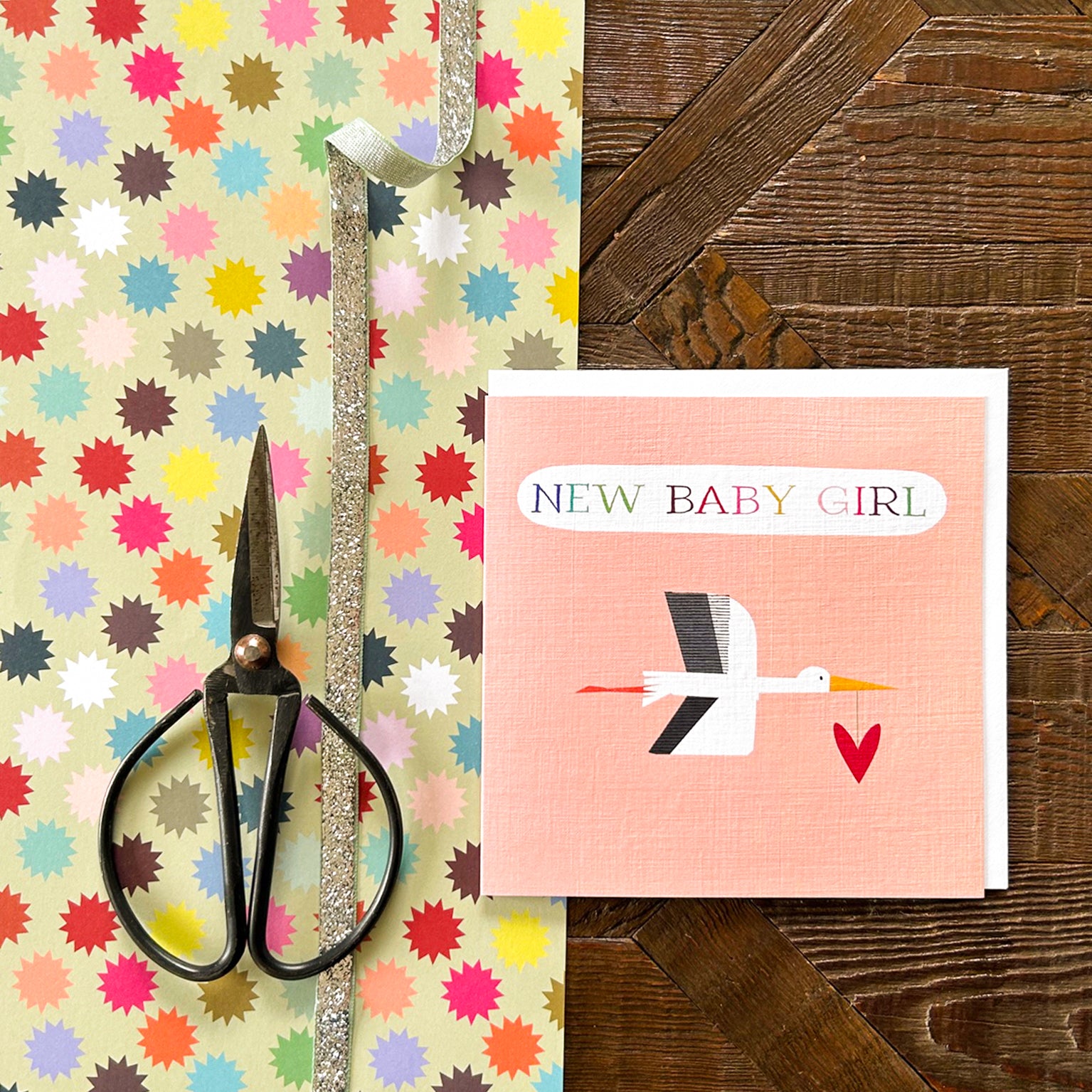 NB34 pink stork baby girl card