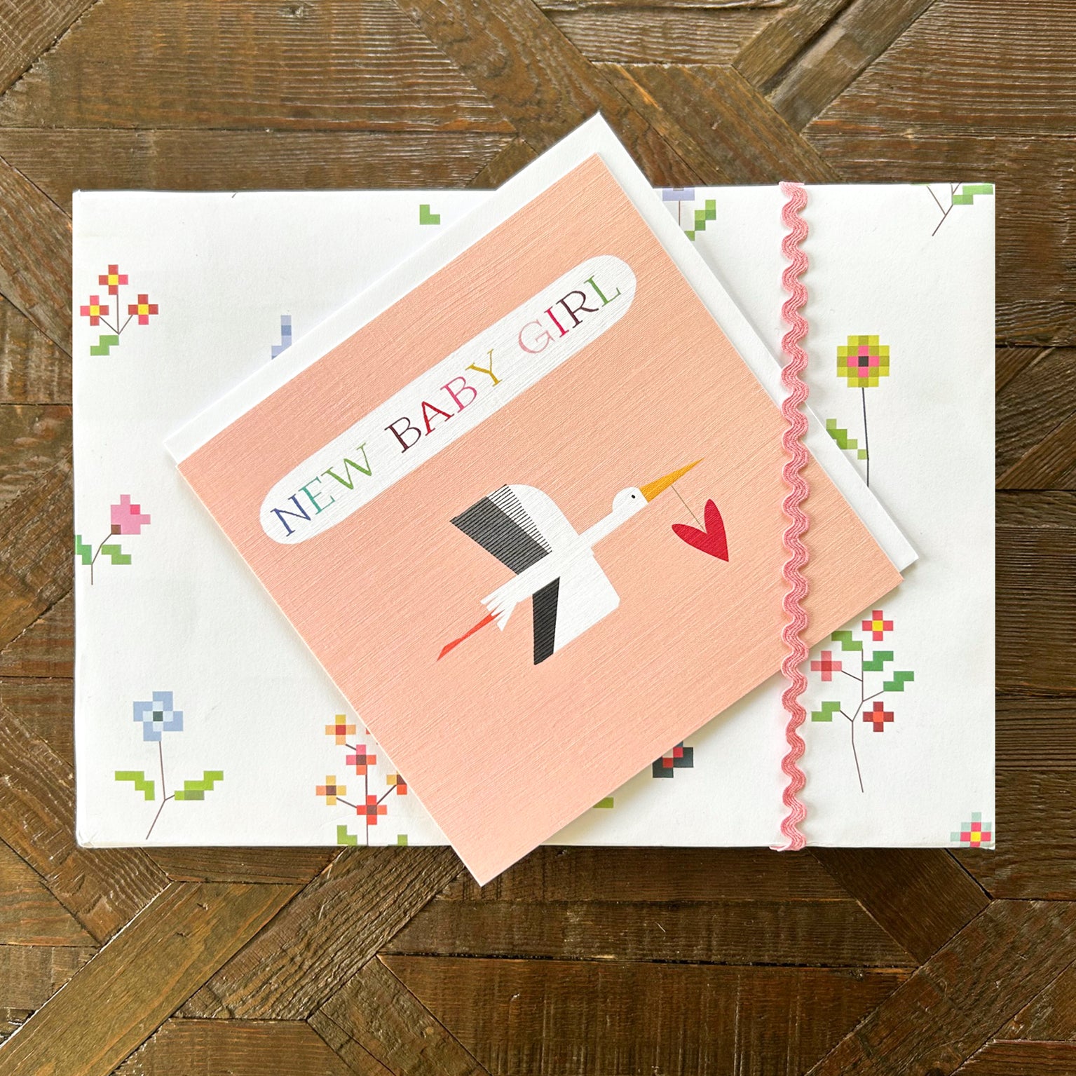 NB34 pink stork baby girl card
