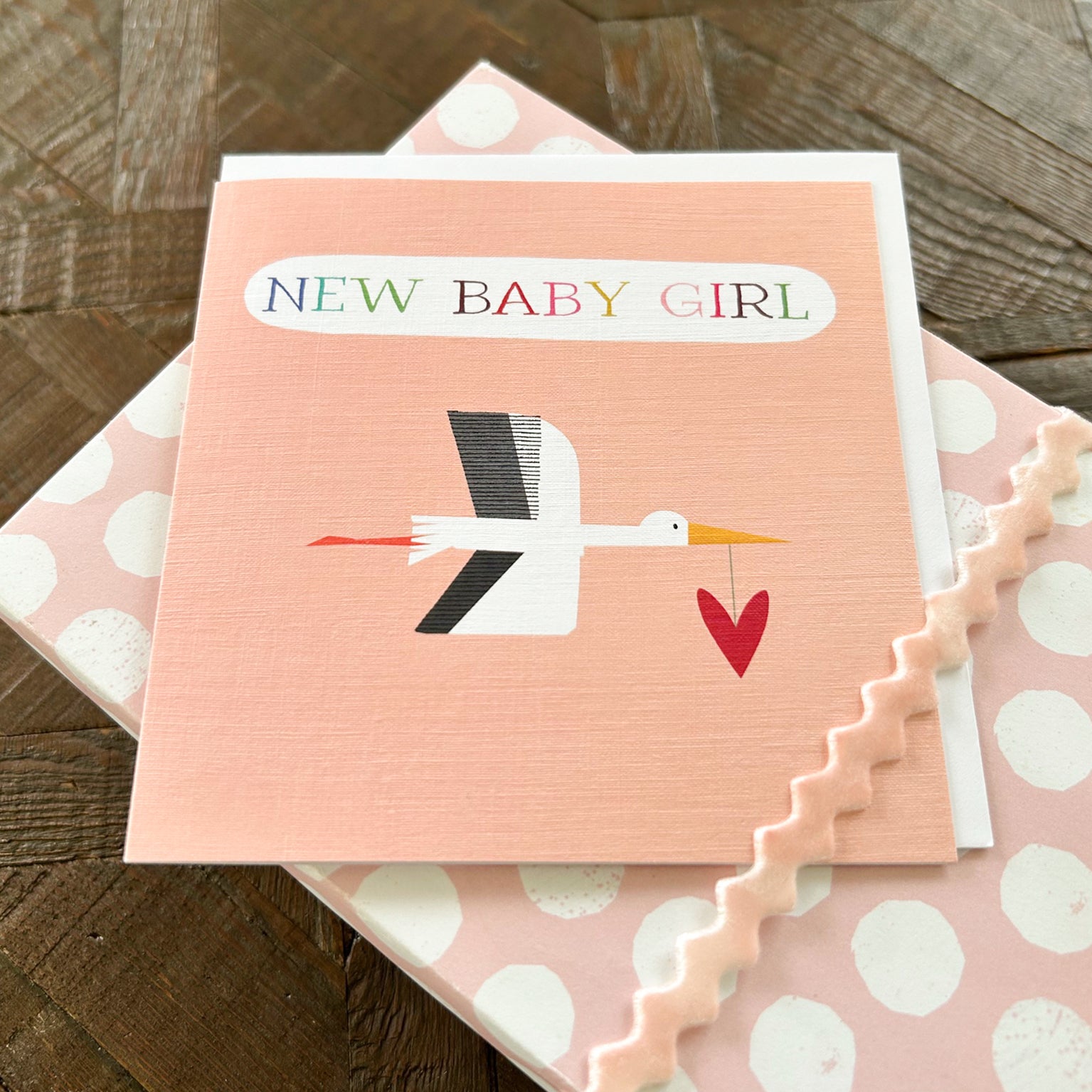NB34 pink stork baby girl card