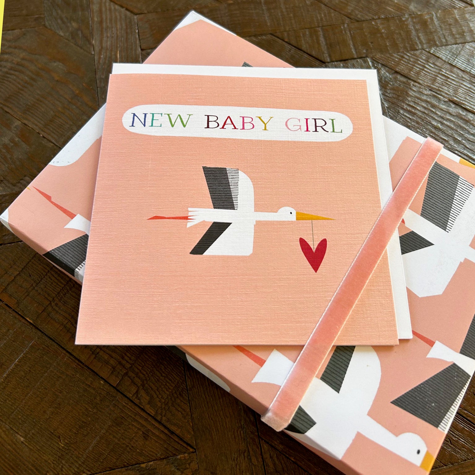 NB34 pink stork baby girl card