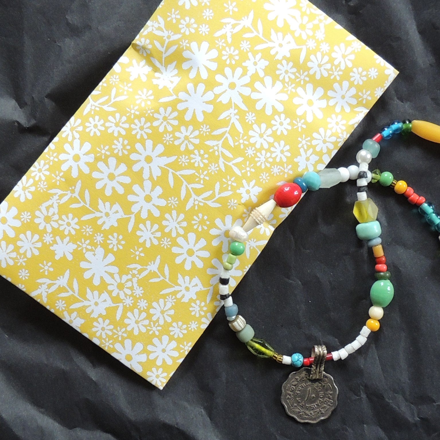 beaded necklace with Egyptian paste scarab bead.